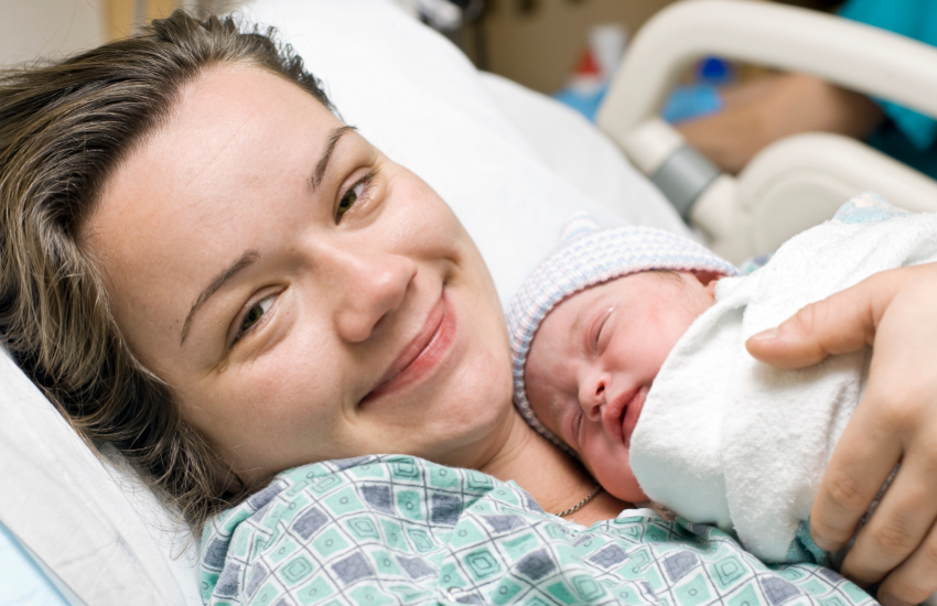 Happy mother with newborn baby